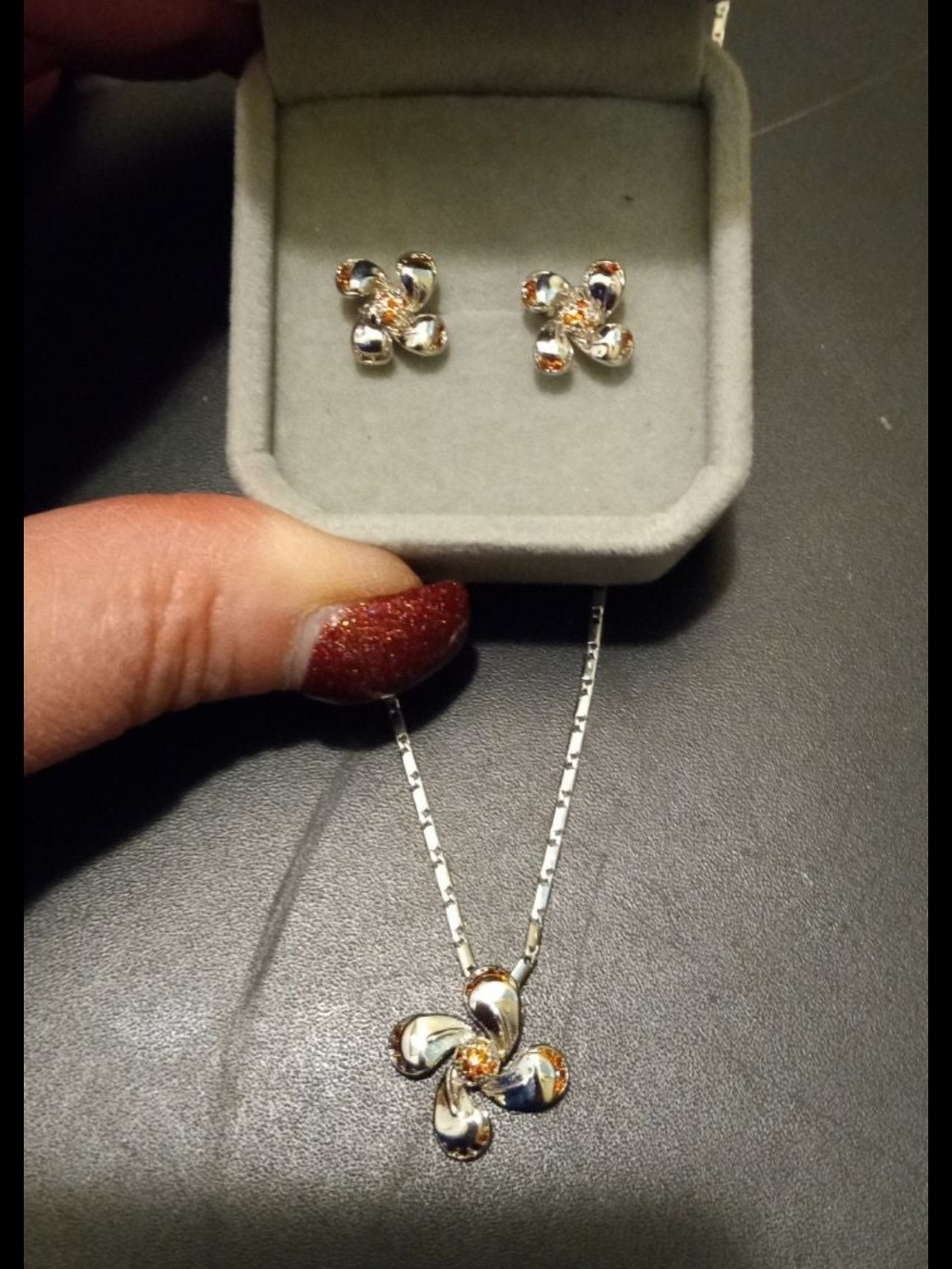 Sterling Silver Flower Pendant Necklace and Stud Earrings With Garnet On The Tip